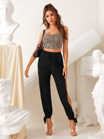 Pantaloni monocolore con orlo annodato a fessura