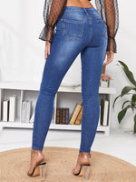 Jeans skinny lavaggio con candeggina flessioni con Sciarpa