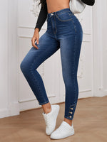 Jeans skinny vita alta bottone orlo