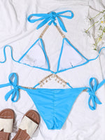 Bikini legato ai lati con catena e strass per la spiaggia estiva