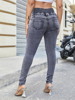 Jeans skinny vita alta con bottone