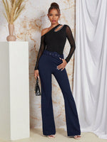 Pantaloni monocolore con gamba svasata con cintura