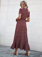 Abito incrociato con nodo con margherita