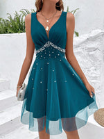 Abito in maglia sovrapposta con perle