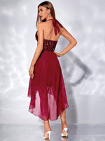 Abito halter paillette a contrasto orlo asimmetrico