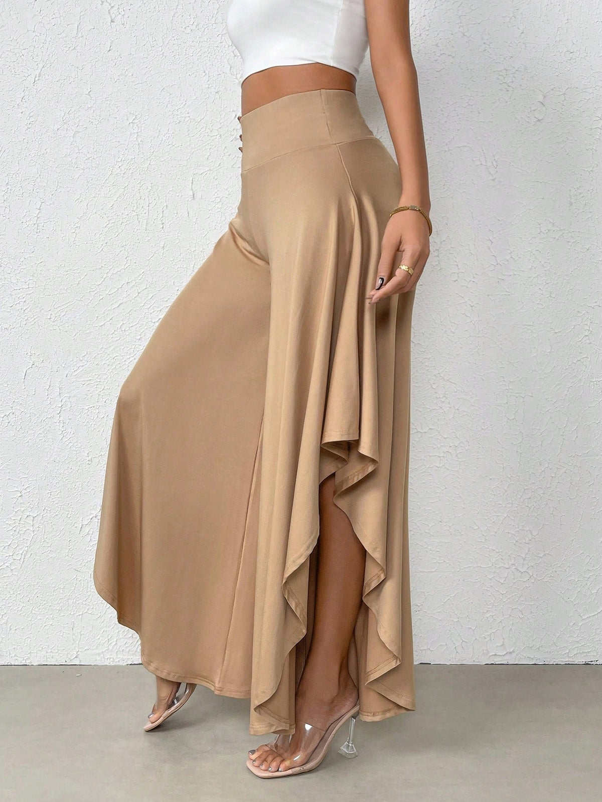 Pantaloni a gamba larga vita alta orlo asimmetrico