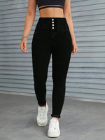 Jeans skinny vita alta con bottone