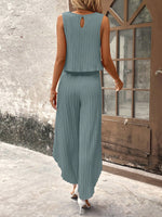 Top di stile vacanziero elegante stampato a pois per signore con pantaloni a gamba larga con spacco avanti