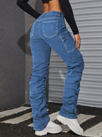 Jeans tasca con patta impilati