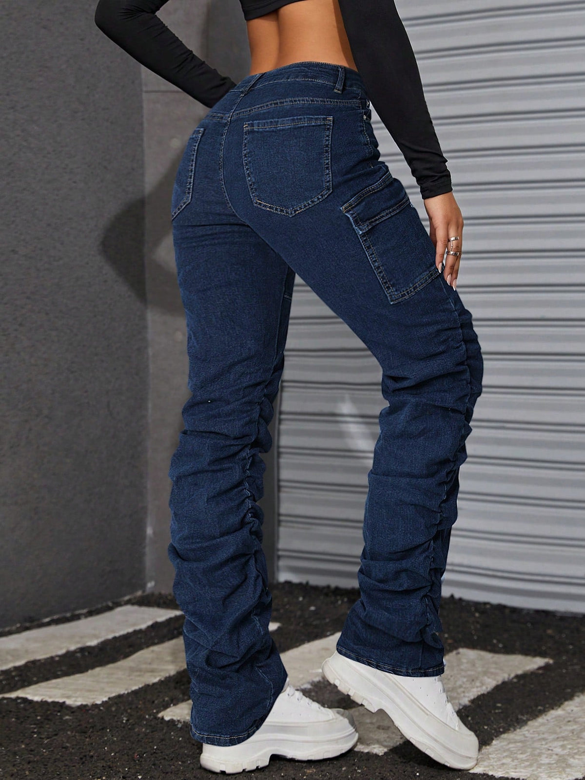 Jeans tasca con patta impilati