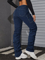 Jeans tasca con patta impilati