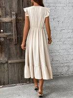 Abito incrociato monocolore con bordo a volant