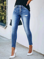 Jeans skinny strappati