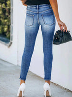 Jeans skinny strappati