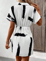 Abito incrociato con stampa pennellate con manica a pipistrello nodo laterale