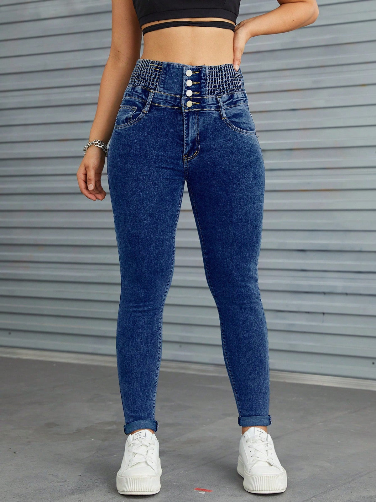 Jeans skinny vita alta con bottone