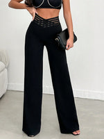 Pantalone Nero A Gamba Larga In Tessuto Di Lycra A Maglia Larga, Con Cintura Elastica A Righe Semi-trasparente E Vita A V