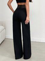 Pantalone Nero A Gamba Larga In Tessuto Di Lycra A Maglia Larga, Con Cintura Elastica A Righe Semi-trasparente E Vita A V