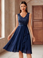 Vestito svasato da cocktail party in chiffon con inserti di paillettes e rifiniture a balze