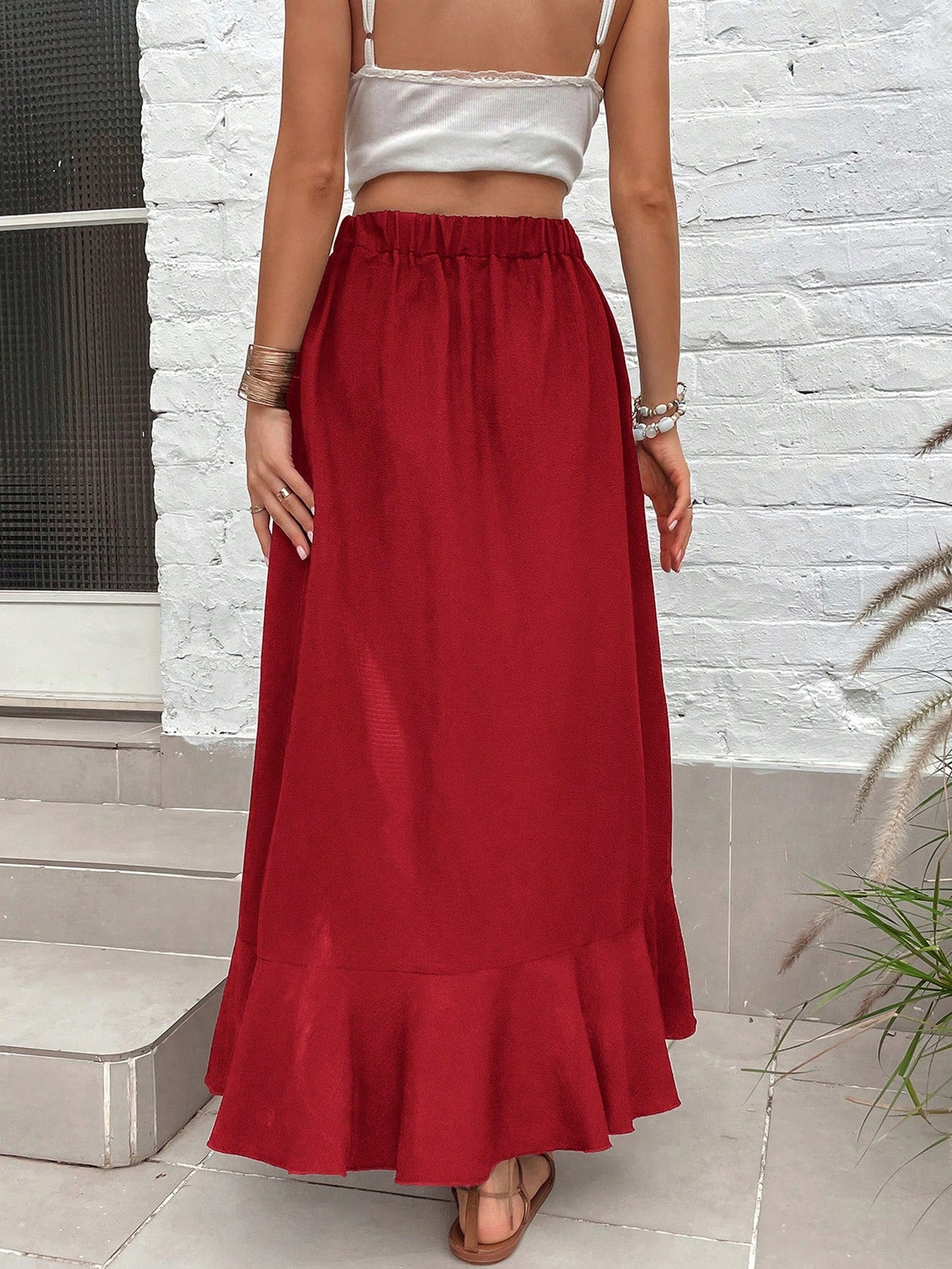 Gonna con orlo a fessura vita alta con bordo a volant