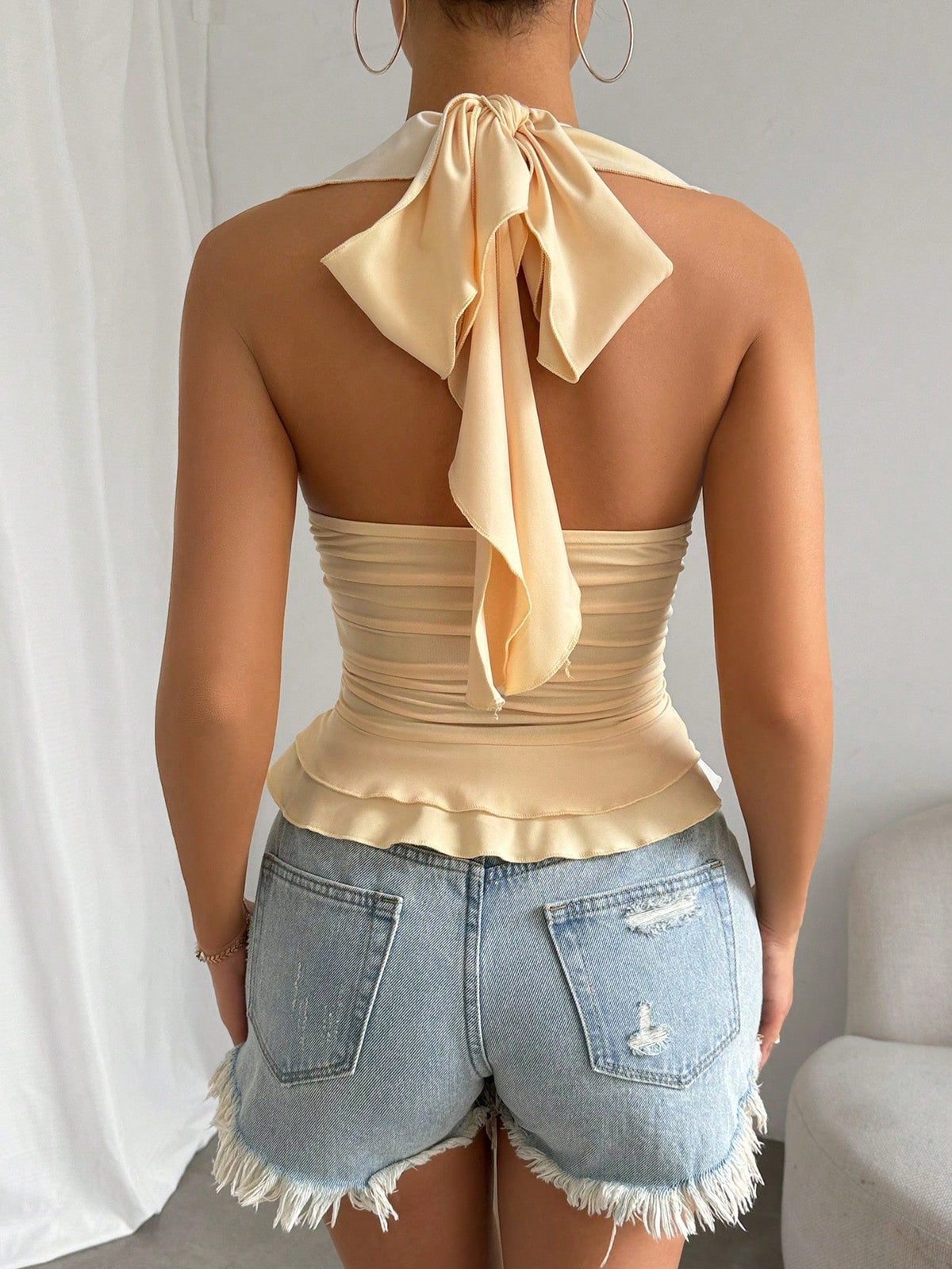 Canotta con bordo a volant plissettato