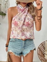 Maglietta estiva senza maniche, con incrocio di alle spalle e stampa floreale per donna