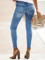 Pantaloni attillati sexy con strappi e tagli con chiusura lampo del 2024