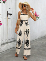 Tuta estiva a gamba larga con stampa floreale a vita alta e bretelle incrociate dietro per donna