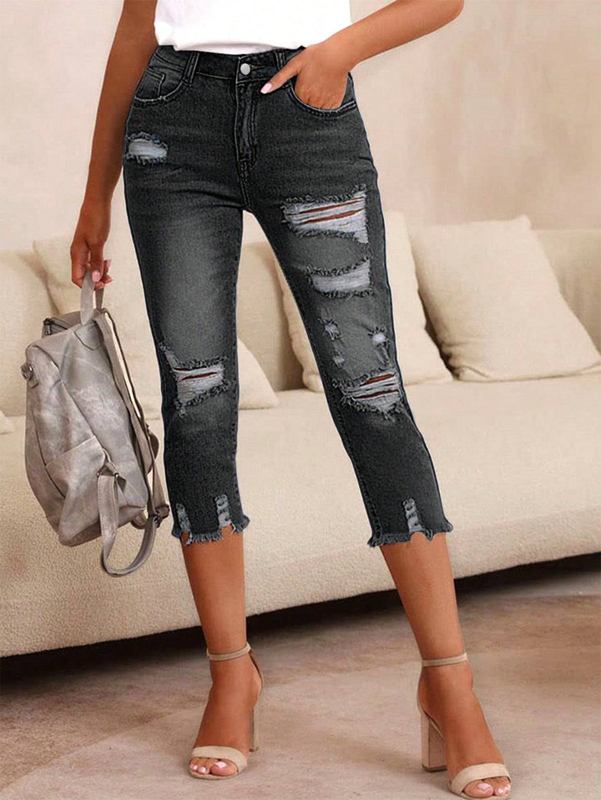 Pantaloni capri denim skinny strappati da donna