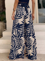 Pantaloni a gamba larga con stampa tropicale