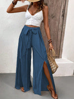 Pantalone casual estivo in tessuto a pieghe solido con vestibilitˆ ampia e taglio largo diviso