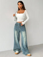 Top a rete Primavera con scollo quadrato nero, orlo asimmetrico e crop per appuntamenti serali