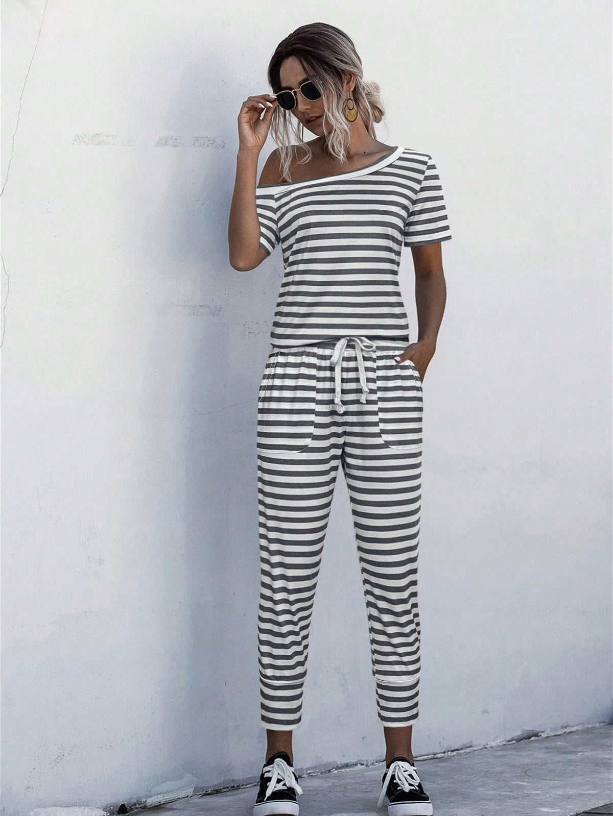 Jumpsuit Maglietta monocolore scollatura asimmetrica con coulisse a vita tasca inclinata