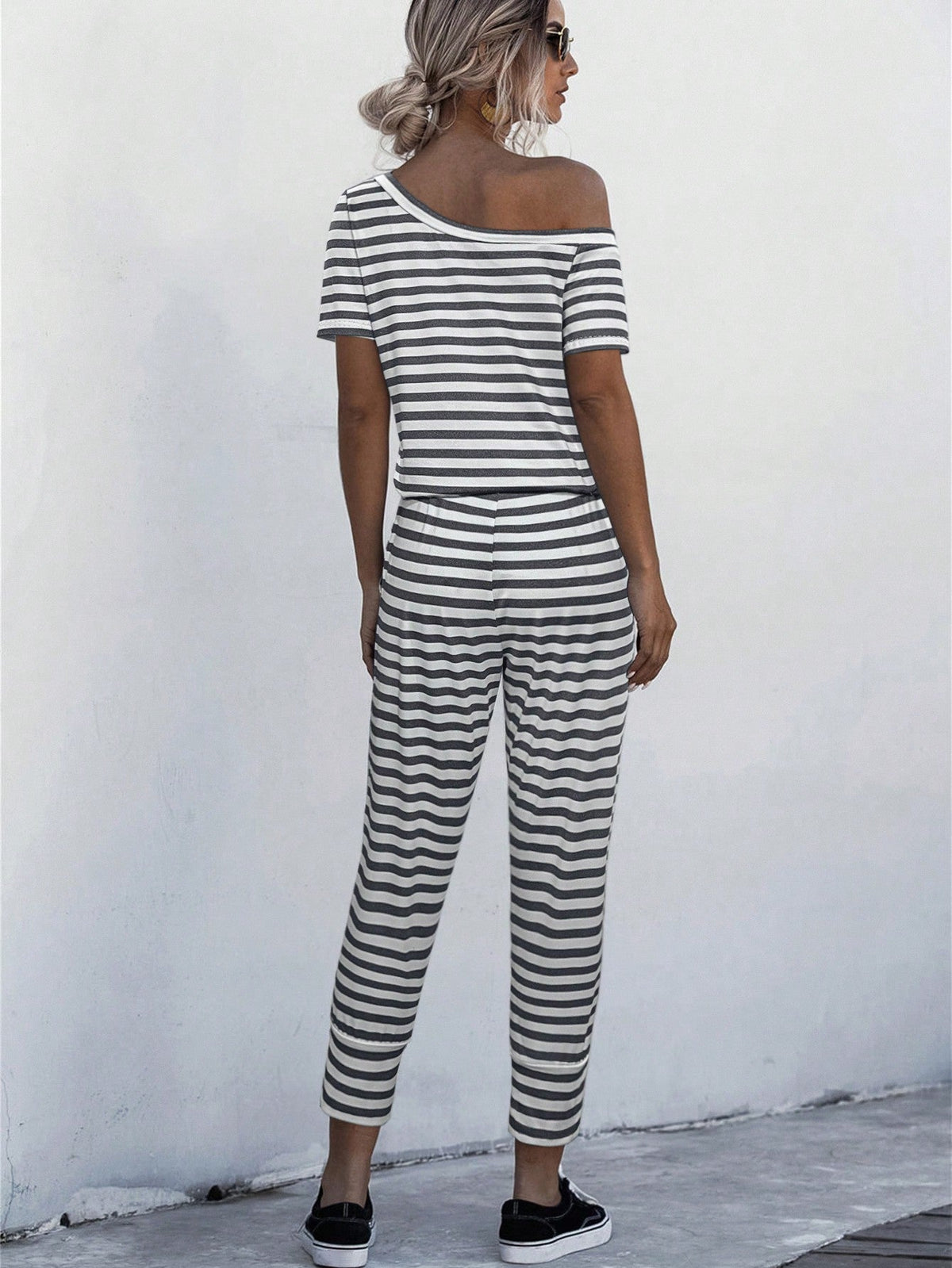 Jumpsuit Maglietta monocolore scollatura asimmetrica con coulisse a vita tasca inclinata