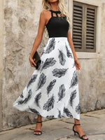 Abito estivo senza maniche con collo rotondo, stampa grafica e fori decorativi