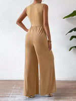 Tuta femminile senza maniche con vita incrociata elegante