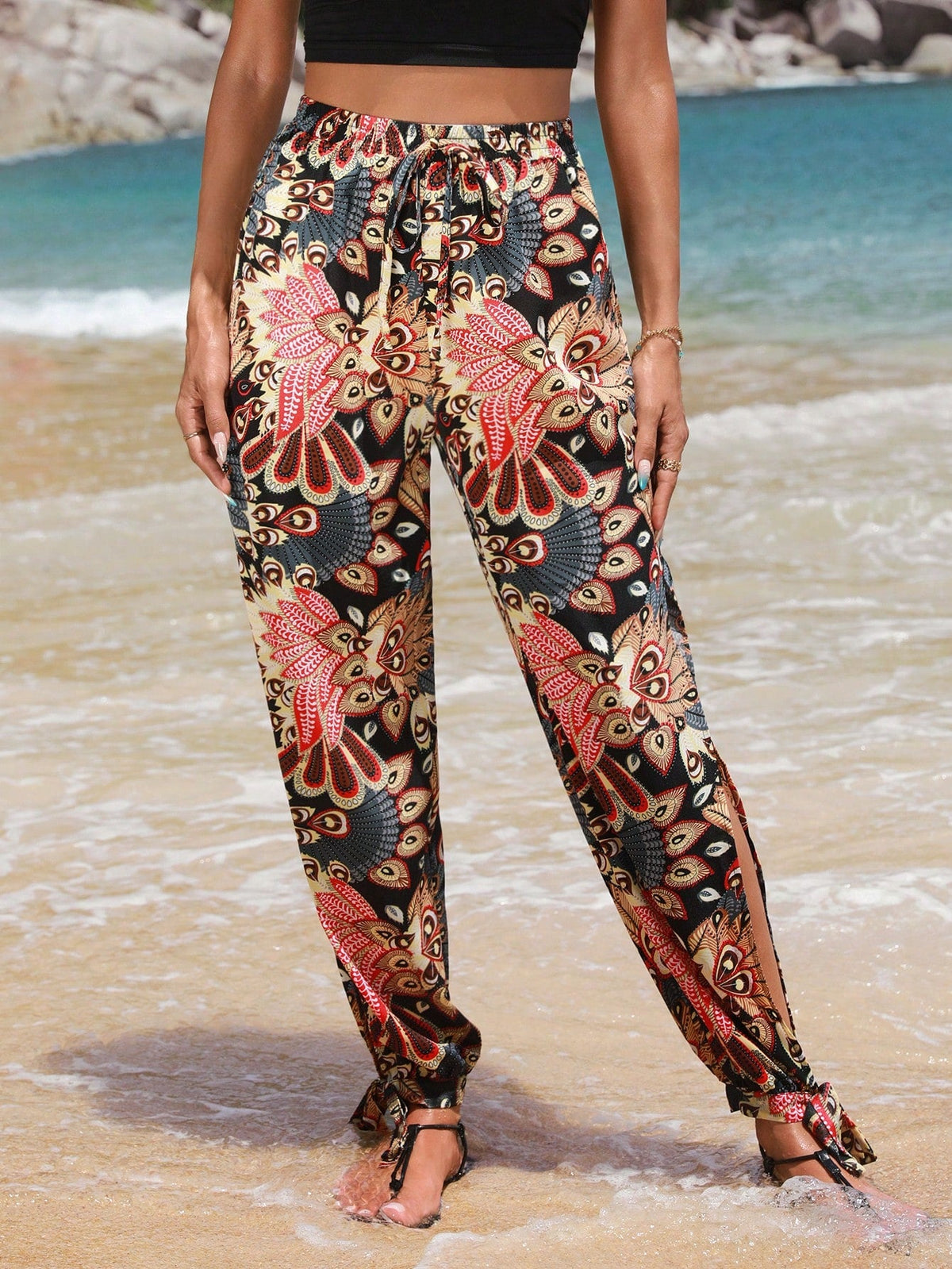 Pantaloni monocolore con orlo annodato a fessura