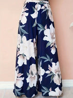 Pantaloni stampati a vita alta con cintura stringata e gambe larghe