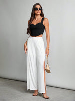 Pantaloni alla moda a vita alta a gamba larga e fruibile laterale di colore unito per donne