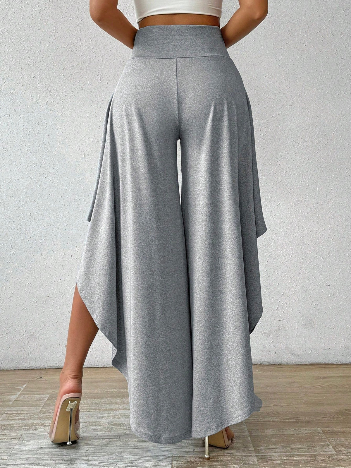 Pantaloni a gamba larga vita alta orlo asimmetrico