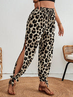 Pantaloni monocolore con orlo annodato a fessura