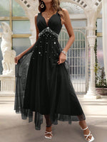 Abito con sovrapposizione a maglia di perline di perle