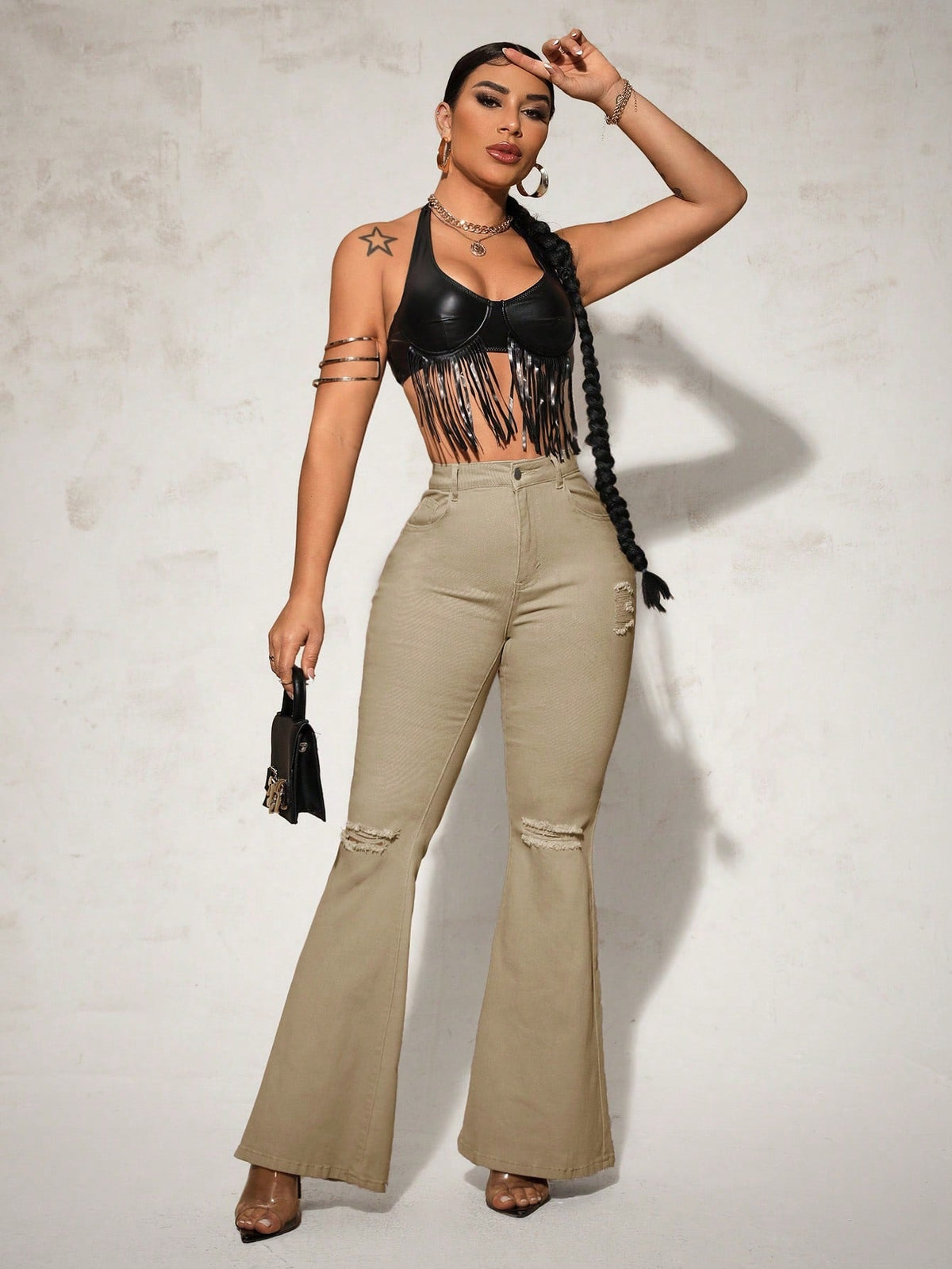 Jeans a gamba svasata vita alta con strappati