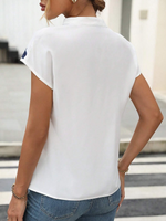 Camicetta con stampa floreale con manica a pipistrello scollo dentellato