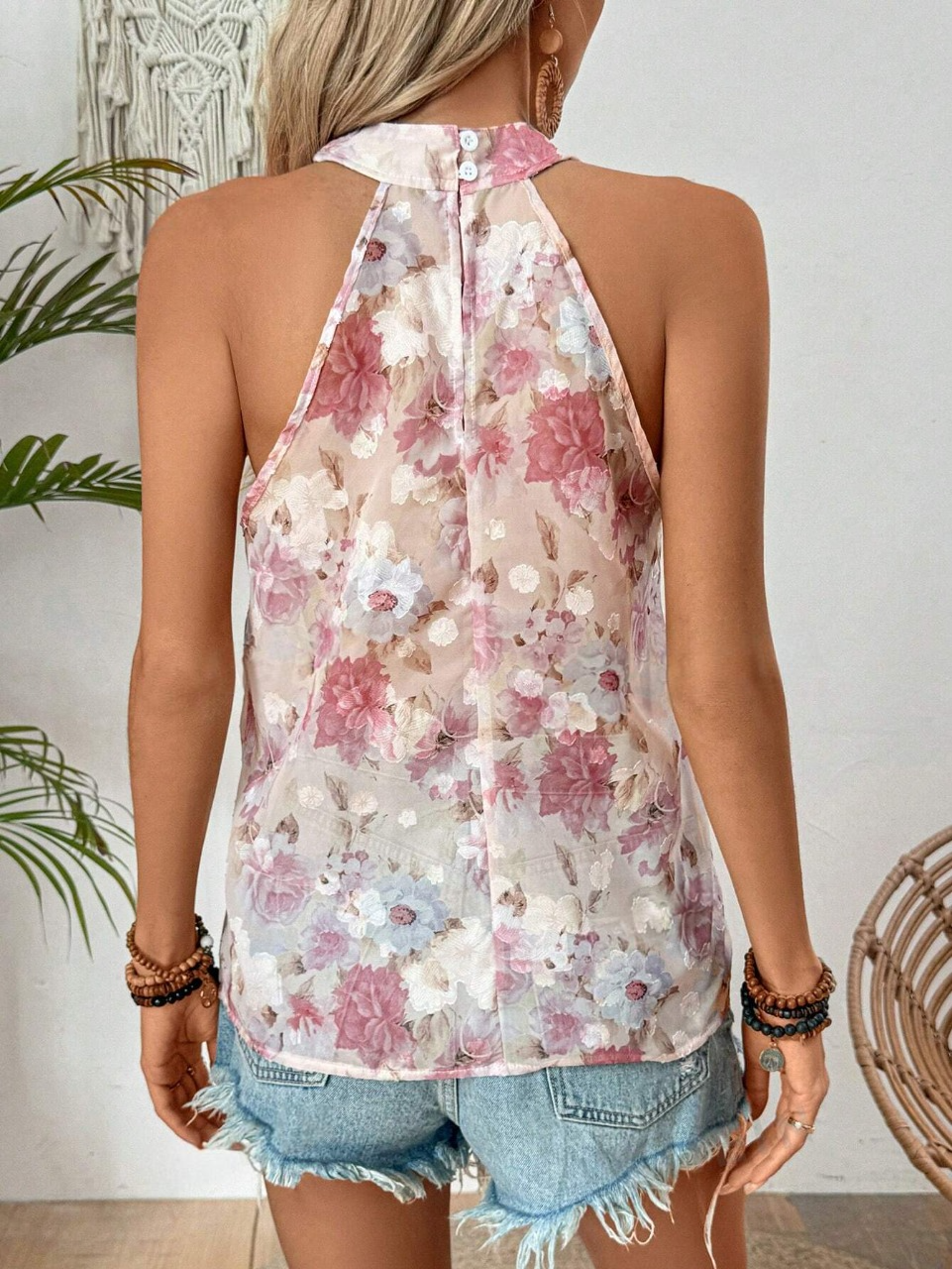 Maglietta estiva senza maniche, con incrocio di alle spalle e stampa floreale per donna