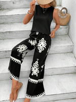 Top senza maniche alla moda di colore solido per donne e pantaloni a gamba dritta stampati