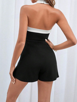 Tutina bordo a contrasto con collo halter con schiena scoperta