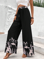 Pantaloni a gamba larga a vita alta con stampa floreale e dettaglio di fiocco sul davanti per donne, neri