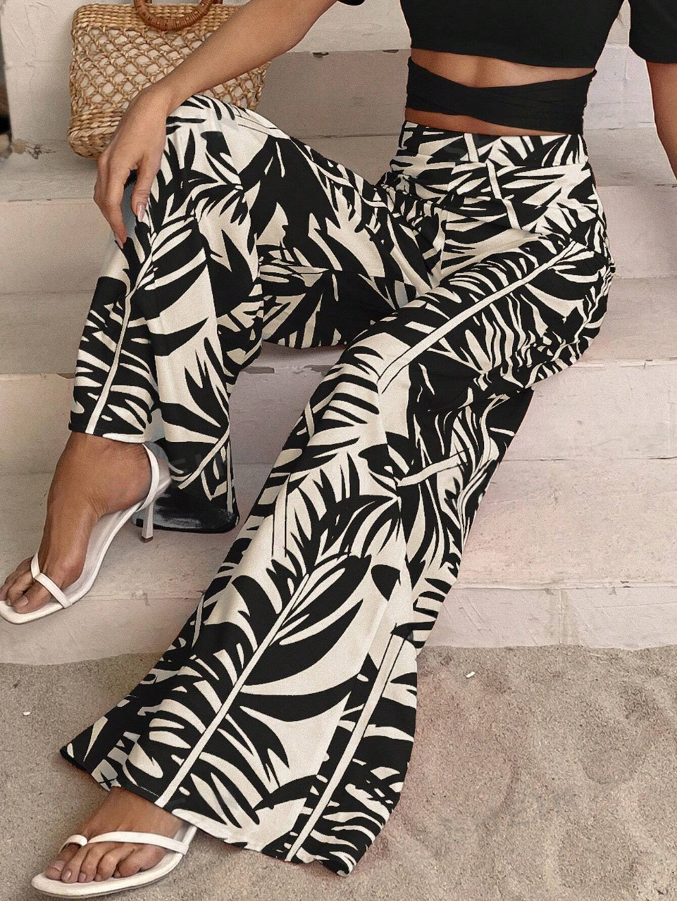 Pantaloni a gamba larga con stampa tropicale