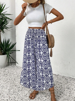 Pantaloni stampati a gamba larga, a vita alta e a svasati per donne in vacanza con orlo a balze